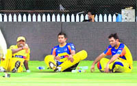 Chennai Super Kings skipper M S Dhon (R) along with Muttiah Muralitharan (L) and Suresh Raina during a practice session in Chennai on Tuesday.  PTI