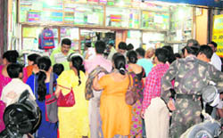Parents throng book shops to buy school books and stationery at the start of the academic session in Dehradun.