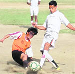 Players vie for the ball at the BS Negi Memorial Prize Money Football Tournament in Dehradun 