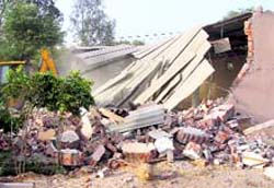 Unauthorised structures that were razed near Rajeev Chowk in Gurgaon on Wednesday. Tribune photo: Sayeed Ahmed