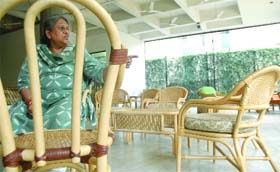 Manju Singh with her furniture during the exhibition in New Delhi