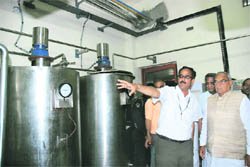 Chief Minister Bhupinder Singh Hooda being informed about the milk plant functioning 