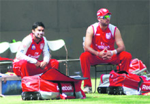 Kings XI captain Kumar Sangakkara (L) and Yuvraj Singh during a practice session at the PCA stadium in Mohali on Thursday.