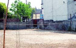 Kin of Animal Husbandry Minister Gulzar Singh Ranike have encroached upon this medical college land and converted it into a volleyball court and errected an iron gate. Photo: Vishal Kumar