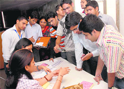 Students during a job fest at Panjab University in Chandigarh on Friday. 