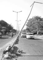 An electric pole that poses a threat of mishaps near YPS chowk in Mohali.