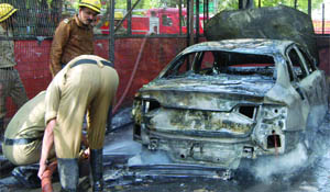 The charred remains of LJP chief Ram Vilas Paswans cars in New Delhi on Friday.