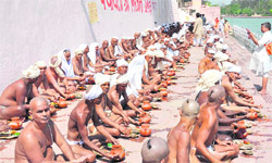 Aspirants perform a ritual to join the Naga camp in Haridwar on Friday. 
