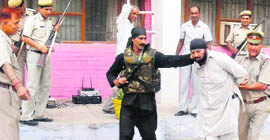 The police with a captured terrorist in a mock drill at Fatehabad on Friday.
