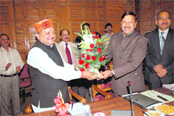 Balwant Singh Bhoryal, Health Minister, Uttarakhand, being welcomed by his Himachal counterpart Rajiv Bindal at Shimla on Friday