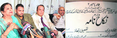 Farisha Siddiqui (L) and M A Sddiqui (R), parents of Ayesha Siddiqui, address a press conference in Hyderabad on Friday and (right) a copy of the marriage certificate released by them.