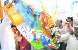 VHP activists burn Sania Mirzas poster in Bhopal on Friday.