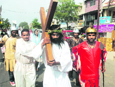 Devotees take part in a procession on Good Friday in Jammu.