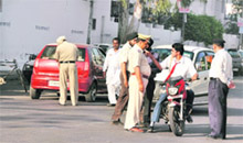 A school student argues with a policeman. 