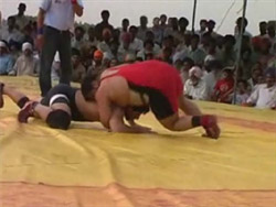 Wrestlers of India and Pakistan in action in Ferozepur on Friday. 