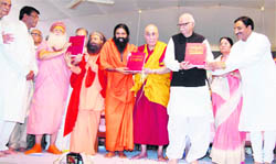 Baba Ramdev, the Dalai Lama, LK Advani and Chief Minister Ramesh Pokhriyal Nishank release The Encyclopaedia of Hinduism in Haridwar