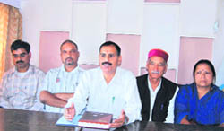 Brij Bhushan Gairola, President, Peyjal Salakhar Anusharvan Samiti, along with other BJP leaders, speaks to the press in Mussoorie