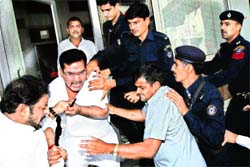 Minister Gopal Kanda in a scuffle with an INLD activist in Sirsa on Saturday. Photo: Amit Soni