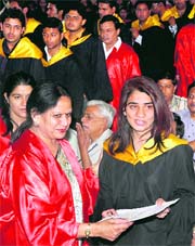 A student receives her degree during the 51st convocation of Dyal Singh College in Karnal on Saturday. Tribune photo: Ravi Kumar