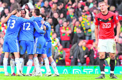 Chelsea players celebrate a goal on Saturday.