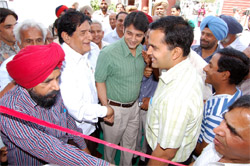 Muktsar DC Varun Roojam shakes hand with comedy king Mehar Mittal while Ferozepur DC KK Yadav enjoys a joke in Abohar on Sunday.