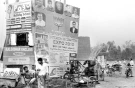 Hoardings on electricity poles on the Zirakpur-Kalka highway near Baltana. Tribune photo: Nitin Mittal