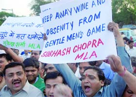Congress workers protest against obscenity in IPL matches near Firozshah Kotla Stadium in New Delhi