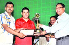 NS Napchilayal, Chief Secretary, gives away prizes to the winners of the Civil Secretariat Badminton Championship in Dehradun on Sunday. A Tribune photograph