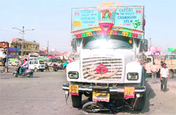The mangled remains of a moped that was crushed under the truck in which Parvesh (inset) was killed in Ludhiana on Sunday.