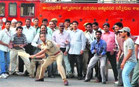 Police Commissioner AK Khan plays cricket near the Charminar in the old city of Hyderabad