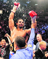 Britain's David Haye celebrates beating John Ruiz of the USA to retain the WBA Heavyweight World Championship boxing match at the MEN Arena in Manchester on Saturday.