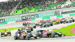 Cars head out on the track at the start of the Malaysian GP in Sunday. 