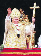 Pope Benedict XVI waves as he arrives to deliver the Urbi et Orbi message at the end of the Easter mass in Saint Peter's Square at the Vatican on Sunday. 