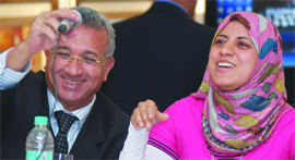 Saima Yehia, a member of Egypts Blind Girls Chamber Orchestra, addresses a press conference as Mohammed Higazy, ambassador of Egypt to India, looks on in New Delhi on Monday.