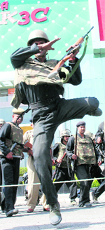 Commandos of the Haryana police take positions during a mock drill at a shopping mall in Karnal on Monday.
