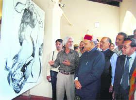 Chief Minister Prem Kumar Dhumal visiting a painting exhibition held by national award winning artists at the Gaiety Theatre in Shimla on Monday.