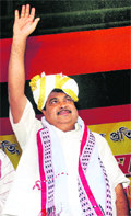 BJP president Nitin Gadkari waves to supporters during a public meeting in Guwahati on Monday. 
