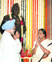 Prime Minister Manmohan Singh exchanges greetings with Lok Sabha Speakar Meira Kumar after paying tributes to Babu Jagjivan Ram on his 103rd birth anniversary in Parliament in New Delhi on Monday. 