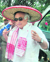 Environment Minister Jairam Ramesh being honoured with a traditional Japi (cap) at Nagaon in Assam on Monday