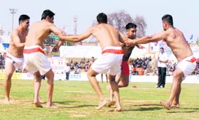 Indian players fight it out with the Italians during the third day of the World Kabaddi Cup at Guru Gobind Singh Stadium in Jalandhar
