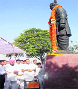 Kalka MLA Pardeep Chaudhary, along with other INLD leaders, offers tributes to former Deputy Prime Minister Devi Lal on his ninth death anniversary at Tau Devi Lal Stadium in Panchkula on Tuesday.
