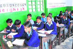 Students take their exams in Rajkiya Uch Prathmic Vidyalaya in Mussoorie.