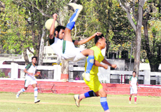 A player tries a cycle kick at the BS Negi Memorial Football Tournament in Dehradun on Tuesday. 