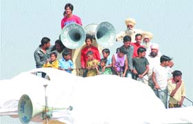 Spectators catch a view of a kabaddi match during the Kabaddi World Cup in Hoshiarpur