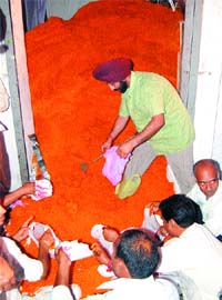 Devotees help pack prashad during Hanuman Jayanti in Amritsar