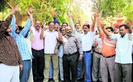 Striking government employees protest in support of their demands in Jammu on Tuesday. Tribune photo: Anand Sharma