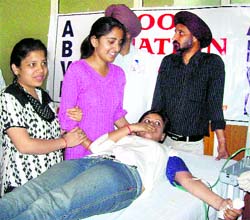 Volunteers donate blood at a camp organised by the ABVP at University of Jammu on Tuesday. Photo: Inderjeet Singh