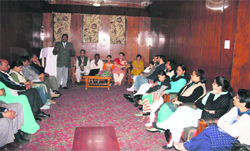 Visiting Kashmiri Pandit families interact with valley people in Srinagar.