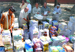 Workers packing books to be distributed in government schools in Jalandhar district on Tuesday. 