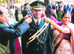 Lt Nishant Karol with his parents during the passing out parade at the Indian Military Academy in December 2008. (A file photograph)